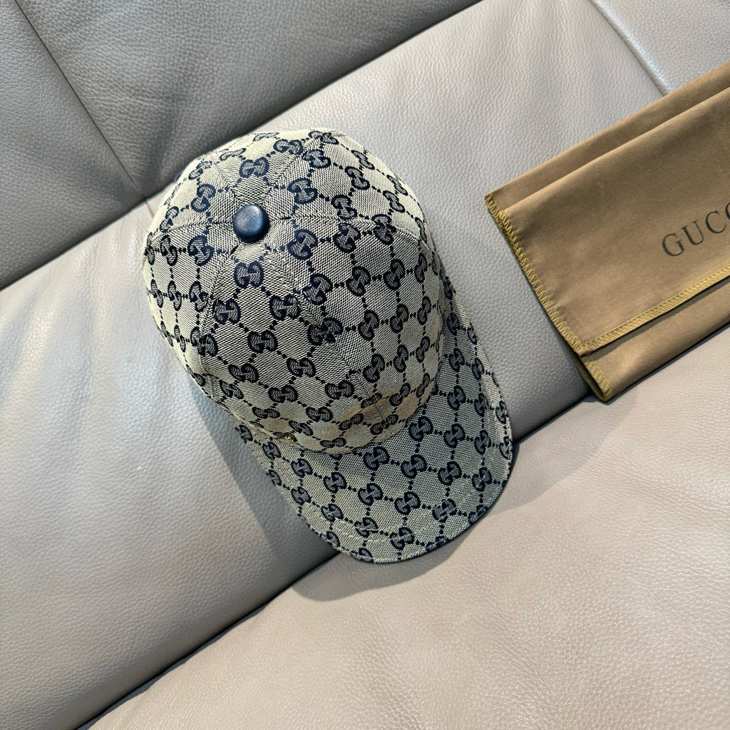 Gucci blue GG patterned cap with round top button and curved brim