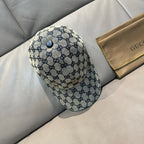 Gucci blue GG patterned cap with round top button and curved brim