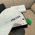 White Prada cap with side PRADA logo text and curved brim