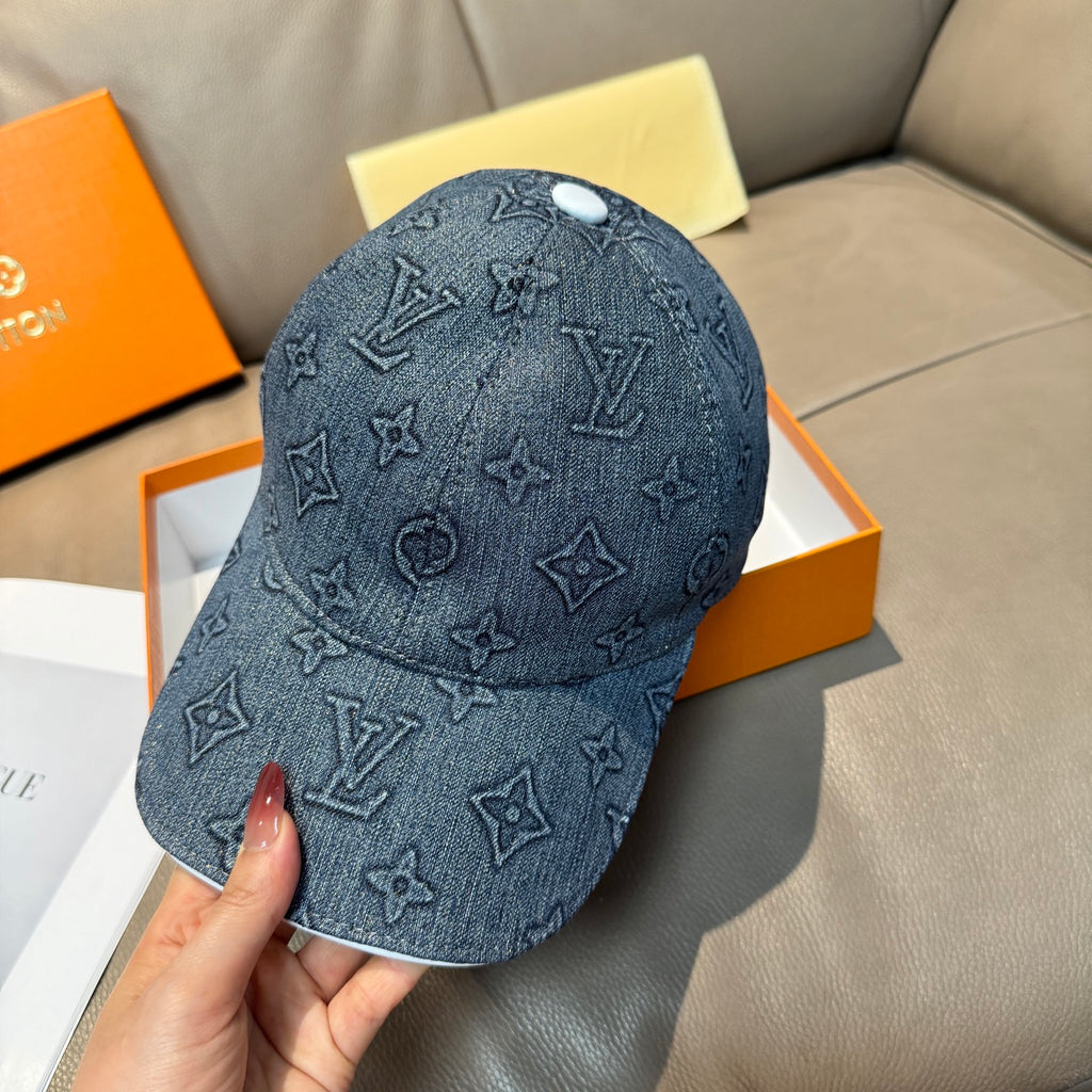 Denim blue Louis Vuitton monogram baseball cap, front view with curved brim and stitched texture