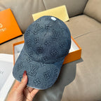 Denim blue Louis Vuitton monogram baseball cap, front view with curved brim and stitched texture