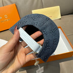 Denim blue Louis Vuitton monogram cap with hand-held brim and white leather strap detail