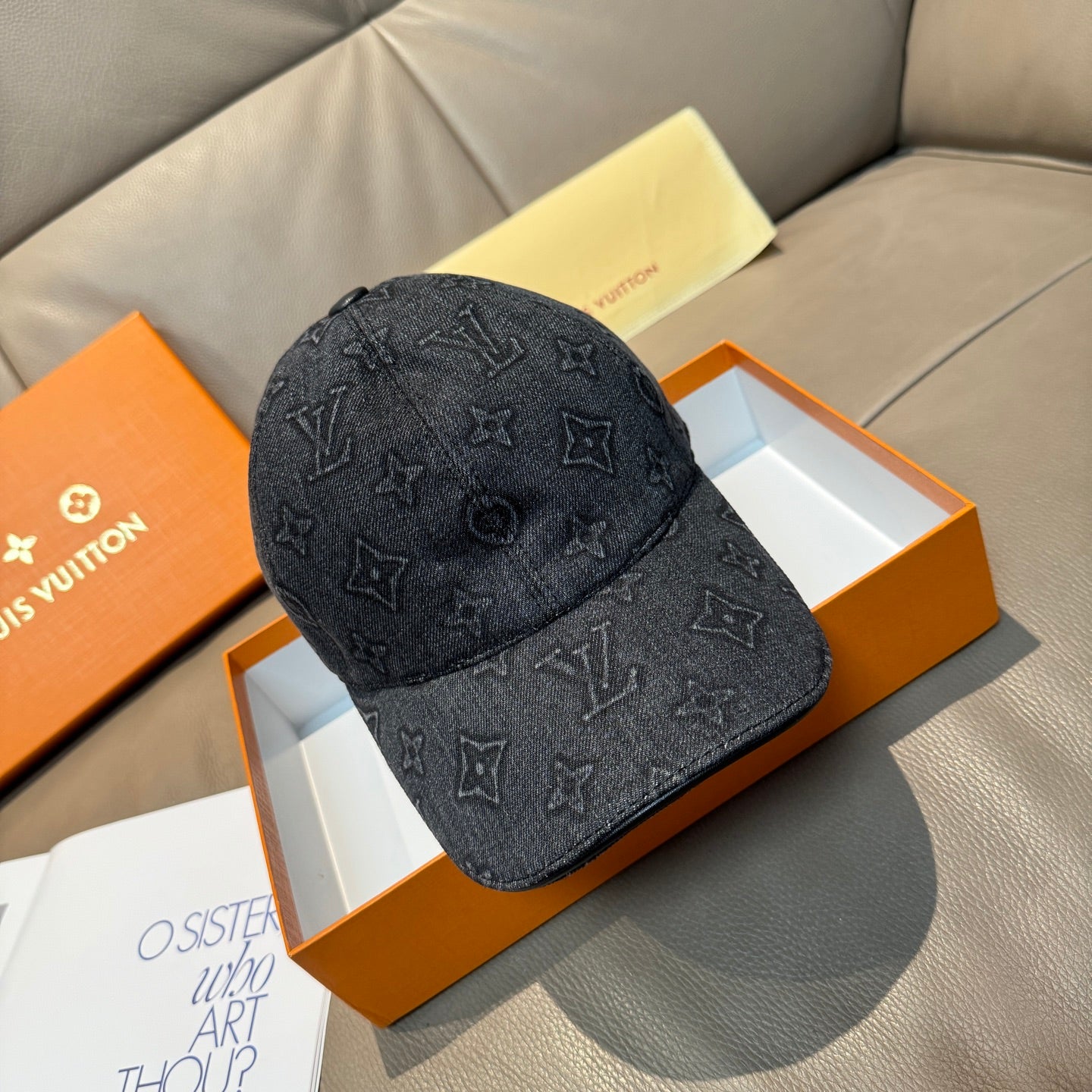 Louis Vuitton denim baseball cap with dark monogram pattern and curved brim