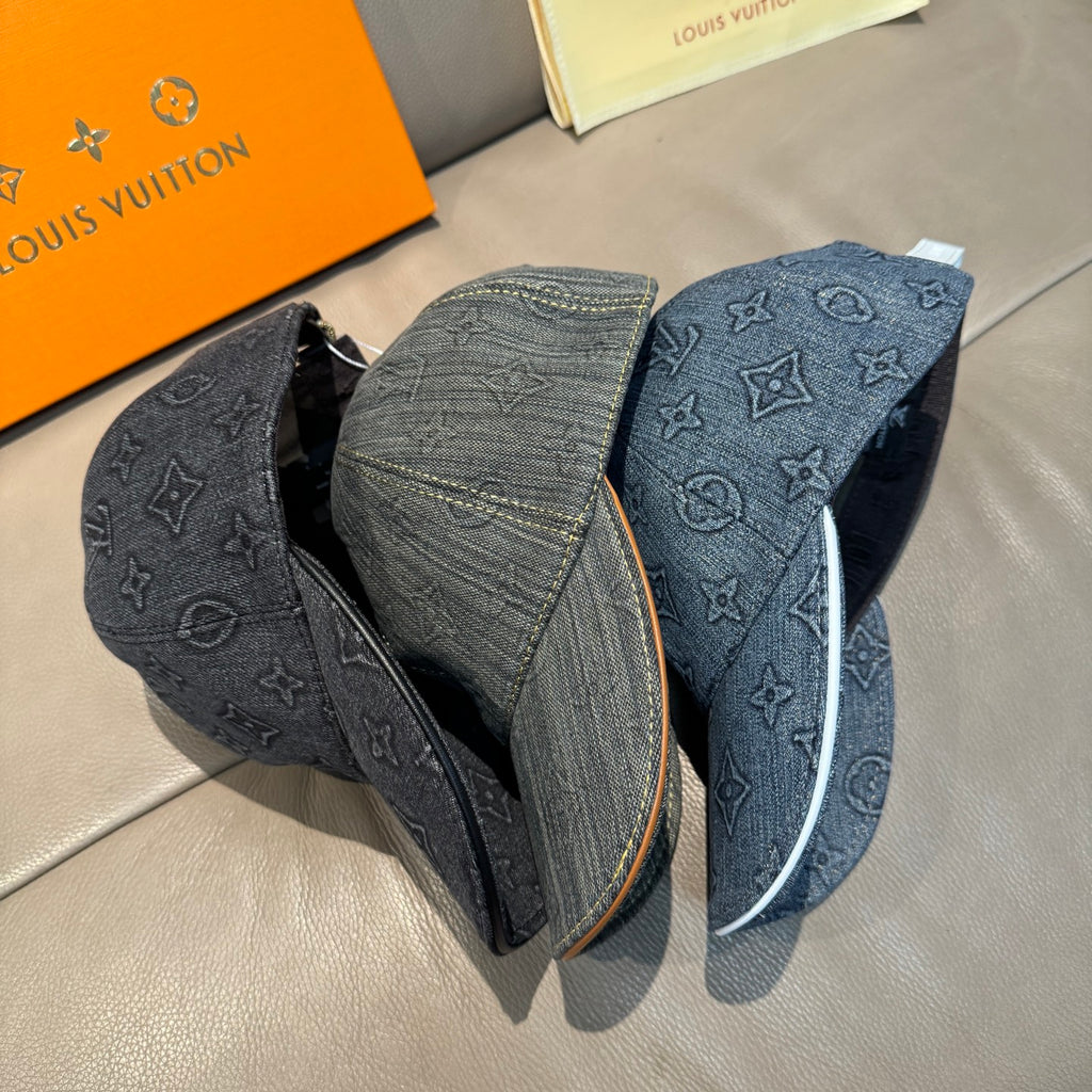 Louis Vuitton denim cap with dark blue-gray monogram panels and tan-edged brim
