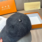 Louis Vuitton denim baseball cap top with dark monogram pattern and circular button