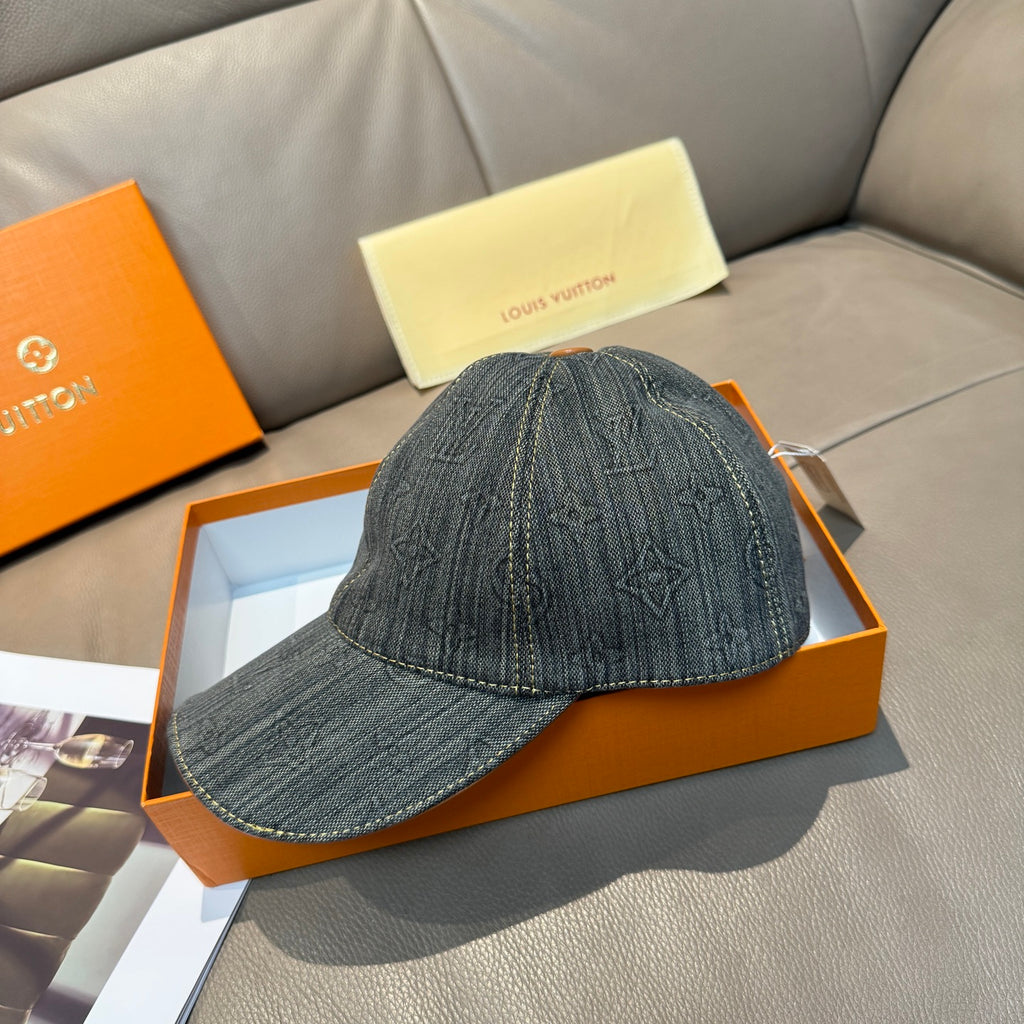Louis Vuitton denim cap with curved brim and LV monogram pattern on front