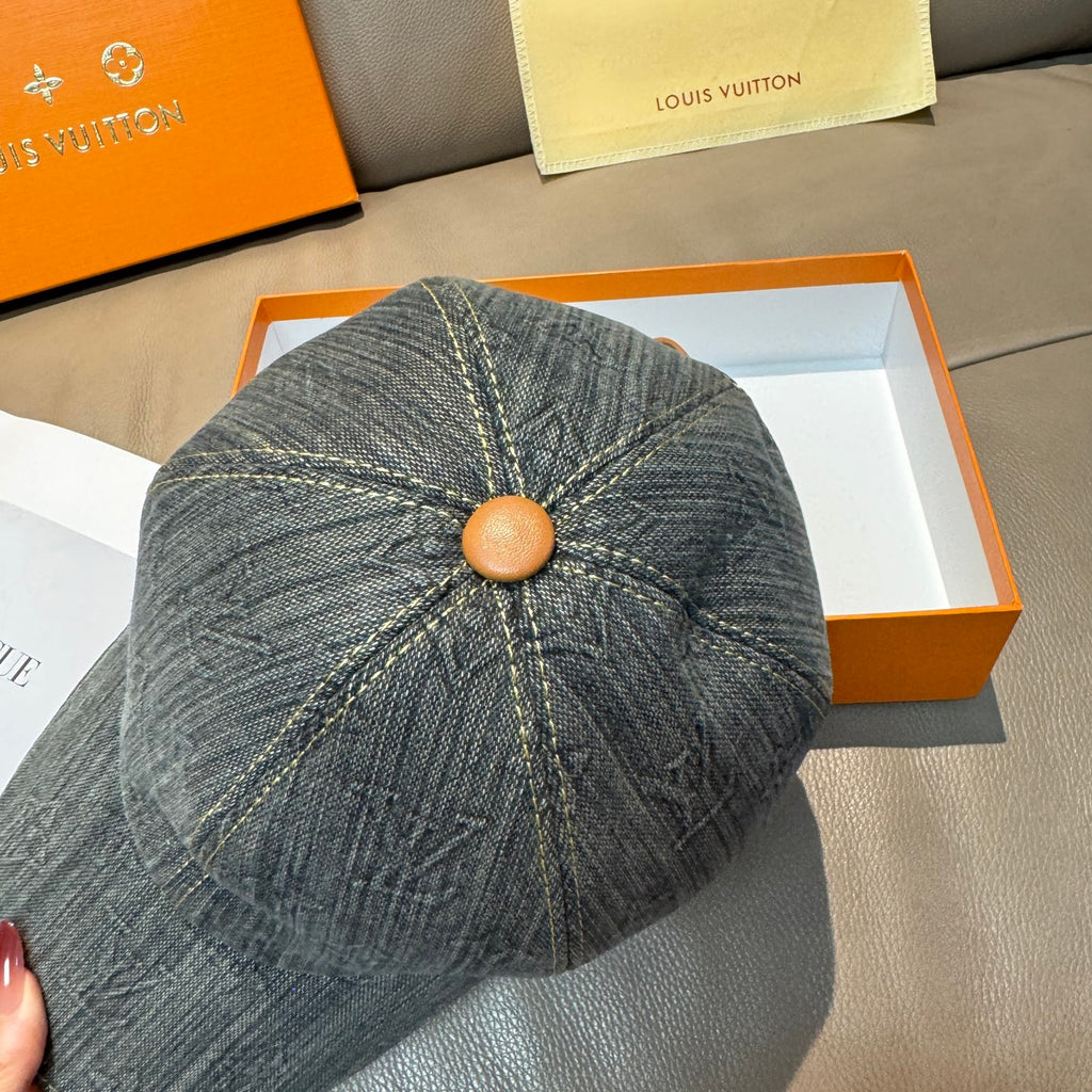 Louis Vuitton denim cap top view with tan button and LV monogram pattern
