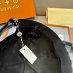 Louis Vuitton baseball cap interior view with black strap and hanging tags