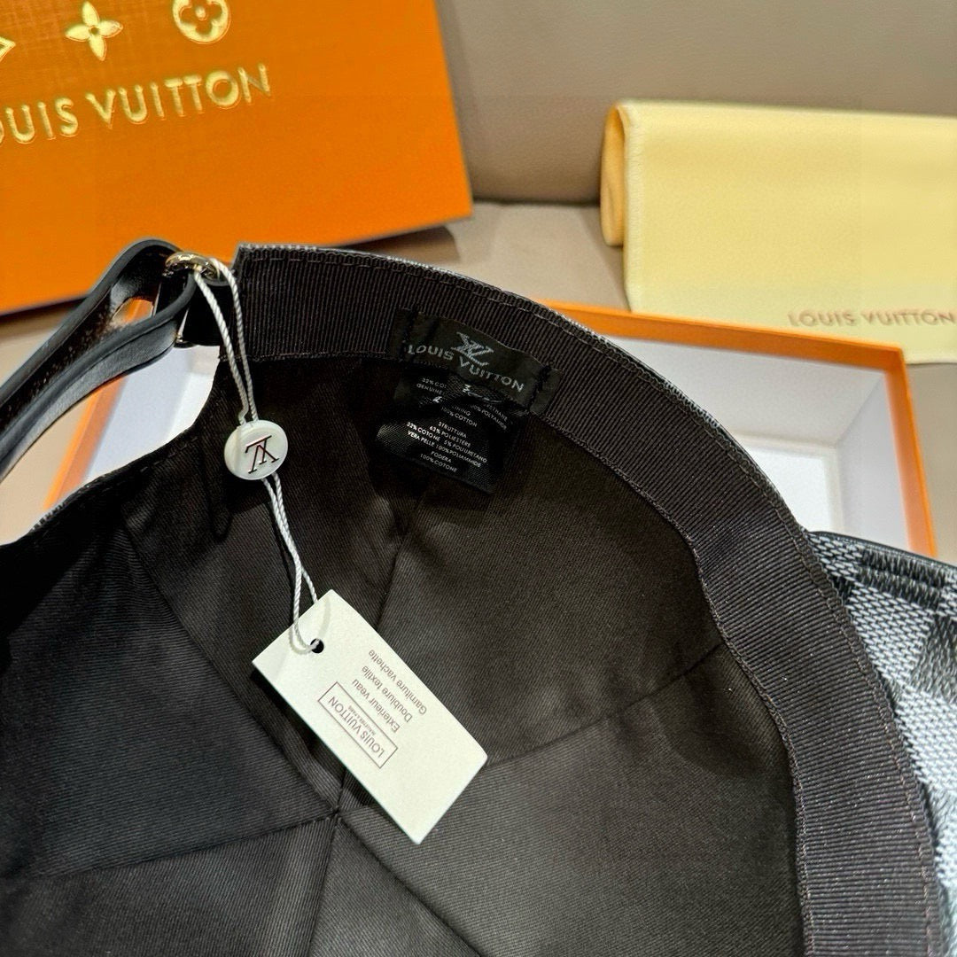 Louis Vuitton baseball cap interior view with black strap and hanging tags