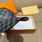 Louis Vuitton checkered baseball cap brim detail, dark blue-gray grid pattern