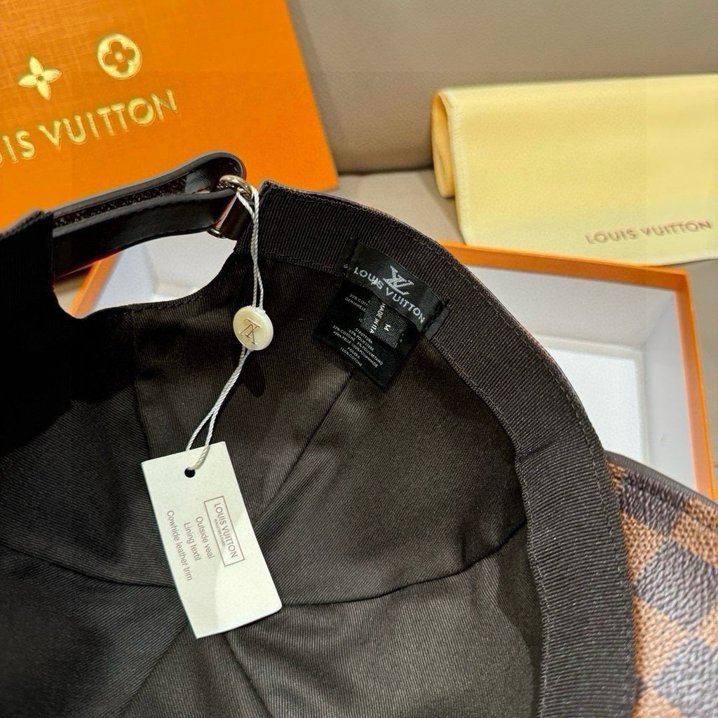 Louis Vuitton cap with adjustable strap and hanging tag, black fabric lining interior