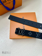 Dark blue belt with monogram pattern, square buckle and multiple holes