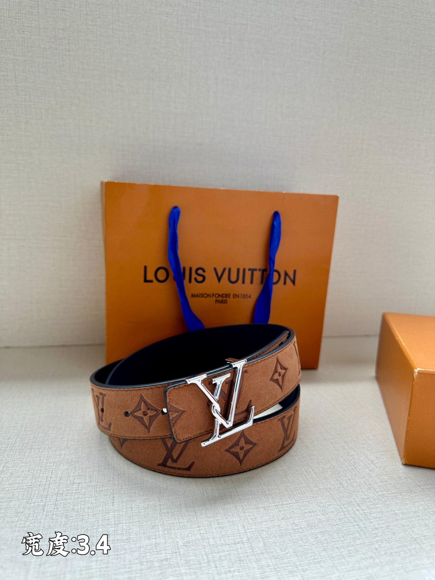 Monogram leather belt with gold-tone V buckle, tan/brown strap with LV pattern