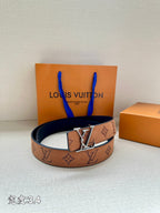 Monogram leather belt with gold-tone V buckle, tan/brown strap around a loop