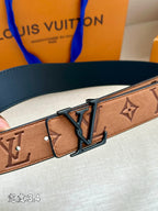 Louis Vuitton belt close-up: brown monogram strap with blue trim and dark buckle
