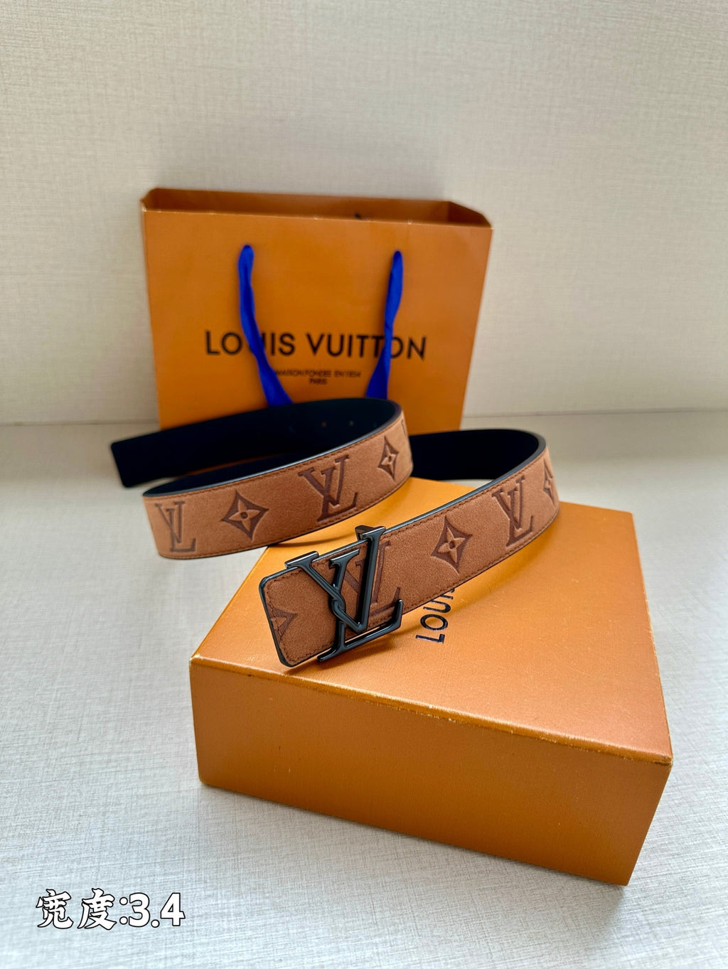 Louis Vuitton belt angled view: brown monogram strap with oversized dark buckle