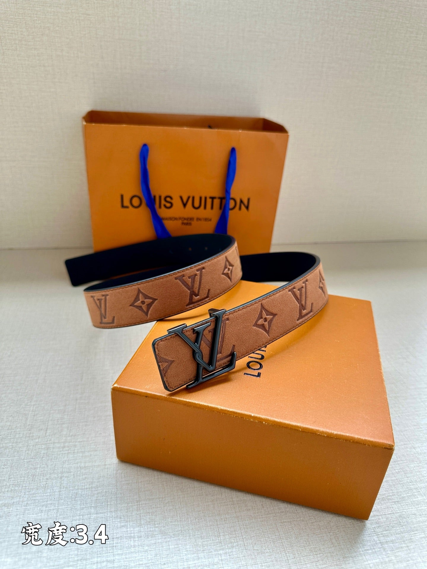 Louis Vuitton belt angled view: brown monogram strap with oversized dark buckle
