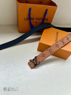 Louis Vuitton belt laid flat, brown monogram strap with dark buckle and keeper
