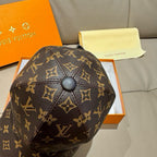 Louis Vuitton monogram baseball cap close-up with round button and gold symbols