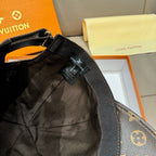 Louis Vuitton monogram cap showing adjustable strap and interior label