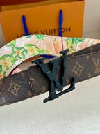 Monogram belt with black LV buckle and floral-lined strap
