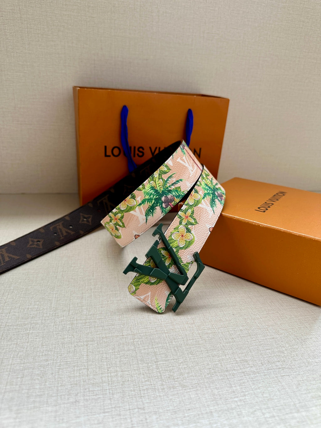 Louis Vuitton belt with floral canvas strap, dark monogram segment, green buckle