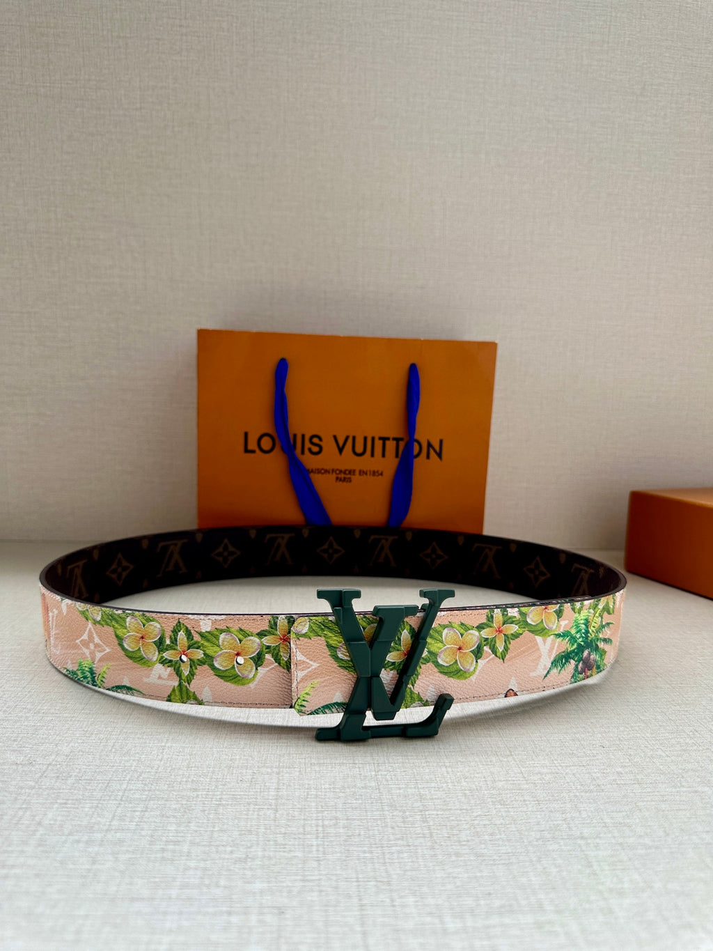 Louis Vuitton belt with floral canvas strap and dark monogram leather edging, green buckle