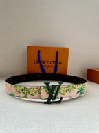 Louis Vuitton belt with floral canvas strap and dark monogram leather edging, green buckle