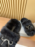 Balenciaga fuzzy sandals with jewel bow detail and dark plush upper