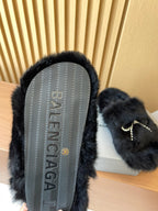 Balenciaga fuzzy sandal with textured outsole visible and dark fur upper