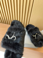 Balenciaga dark fuzzy sandals with crystal bow embellishment on straps