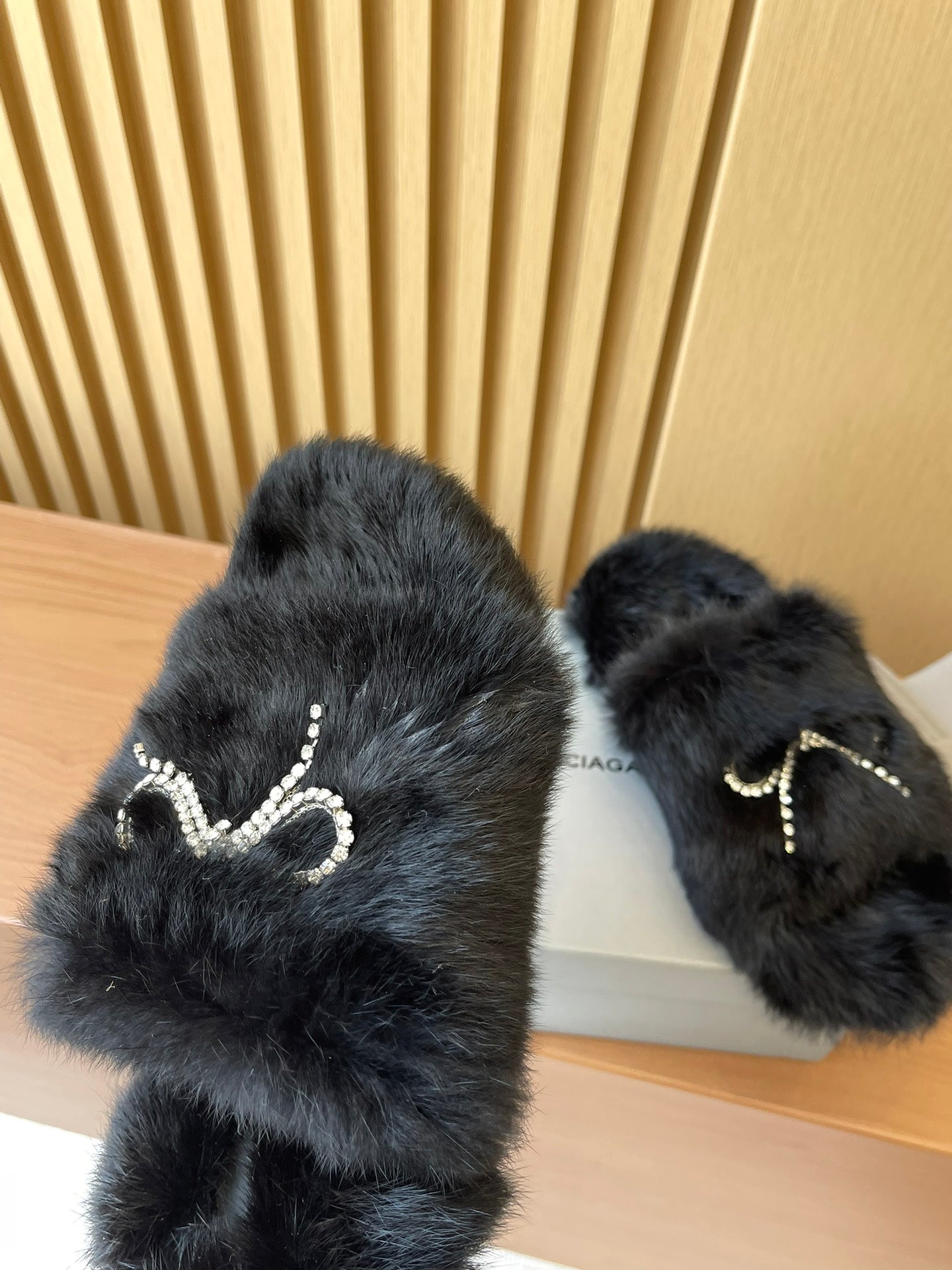Balenciaga dark fuzzy sandals with crystal bow embellishment on straps