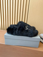 Balenciaga fuzzy slide sandals with jeweled bow detail on dark upper