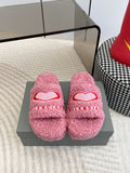 Pink fuzzy slide sandals with red heart logo and open toe