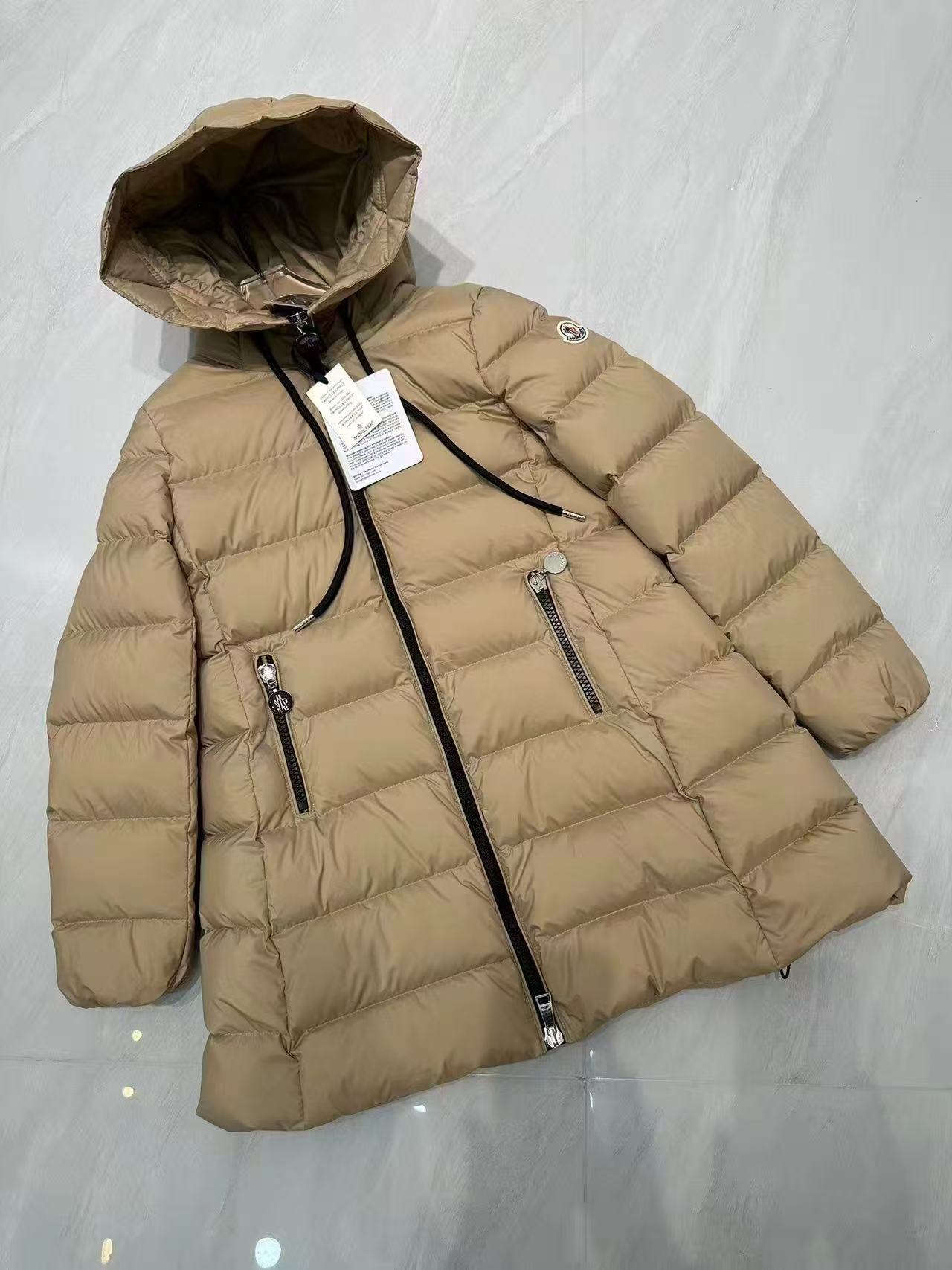 Long puffer coat, light beige, attached hood and zip front