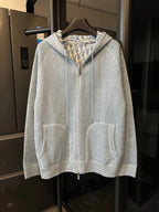 Light gray zip-up hoodie with hood and two front pockets