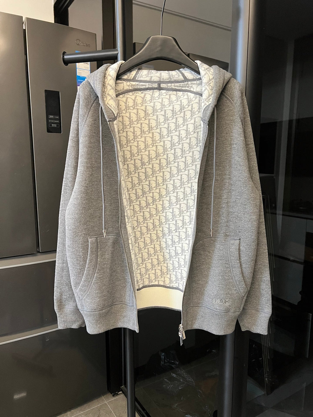 Gray heather zip-up hoodie with hood and monogram print lining, front zipper