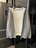 Gray heather zip-up hoodie with hood and monogram print lining, front zipper