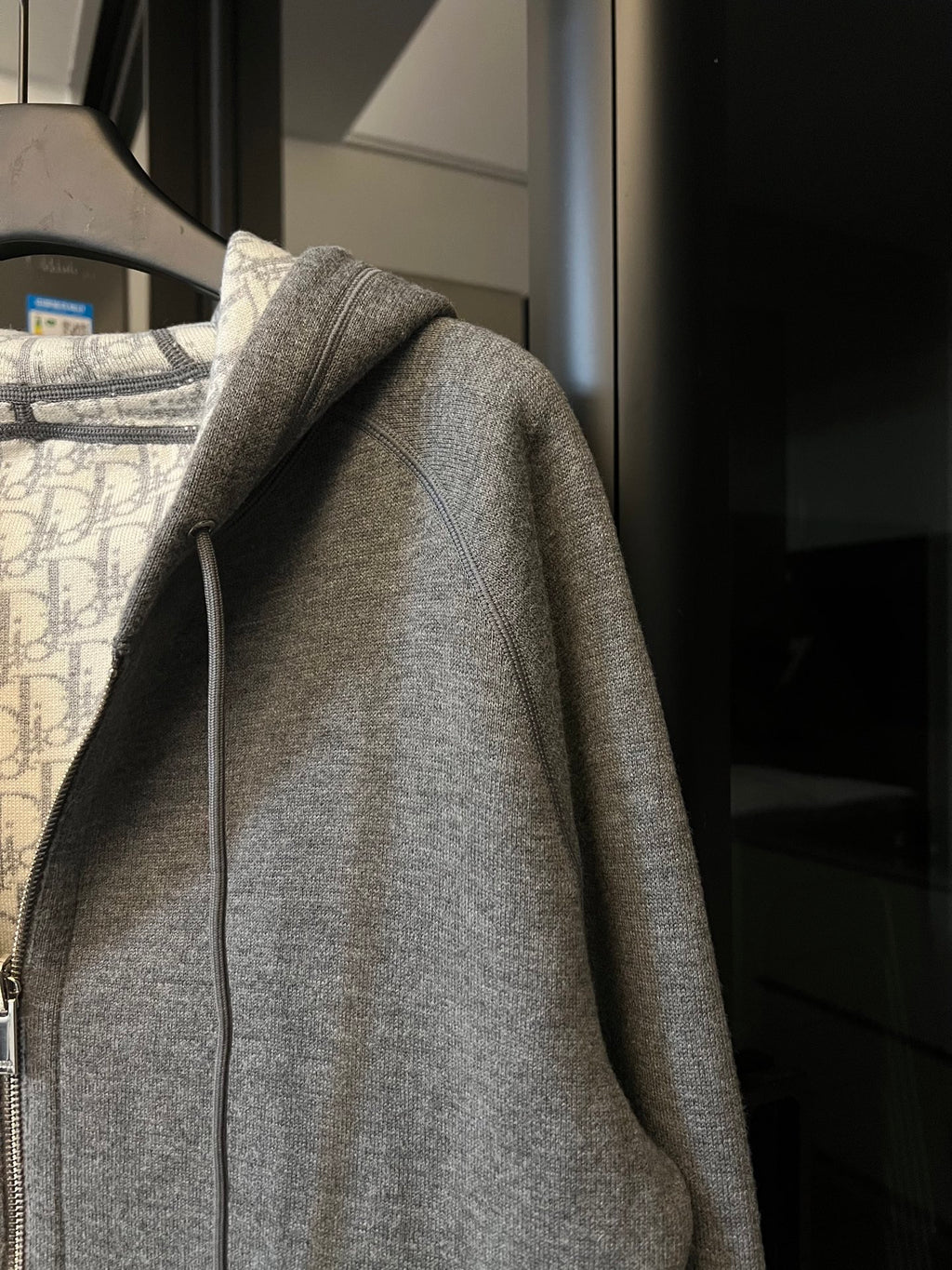 Gray heather zip-up hoodie with long sleeves and ribbed cuffs