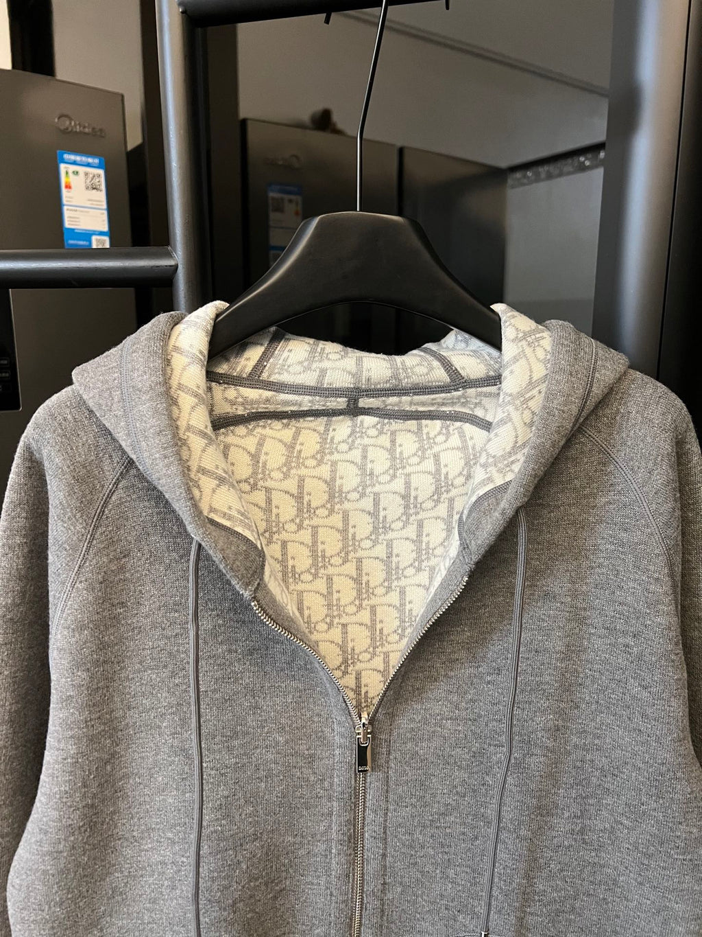 Gray heather zip-up hoodie with hood and front zipper, monogram-lined collar