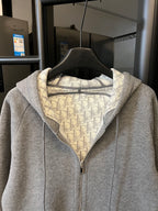 Gray heather zip-up hoodie with hood and front zipper, monogram-lined collar