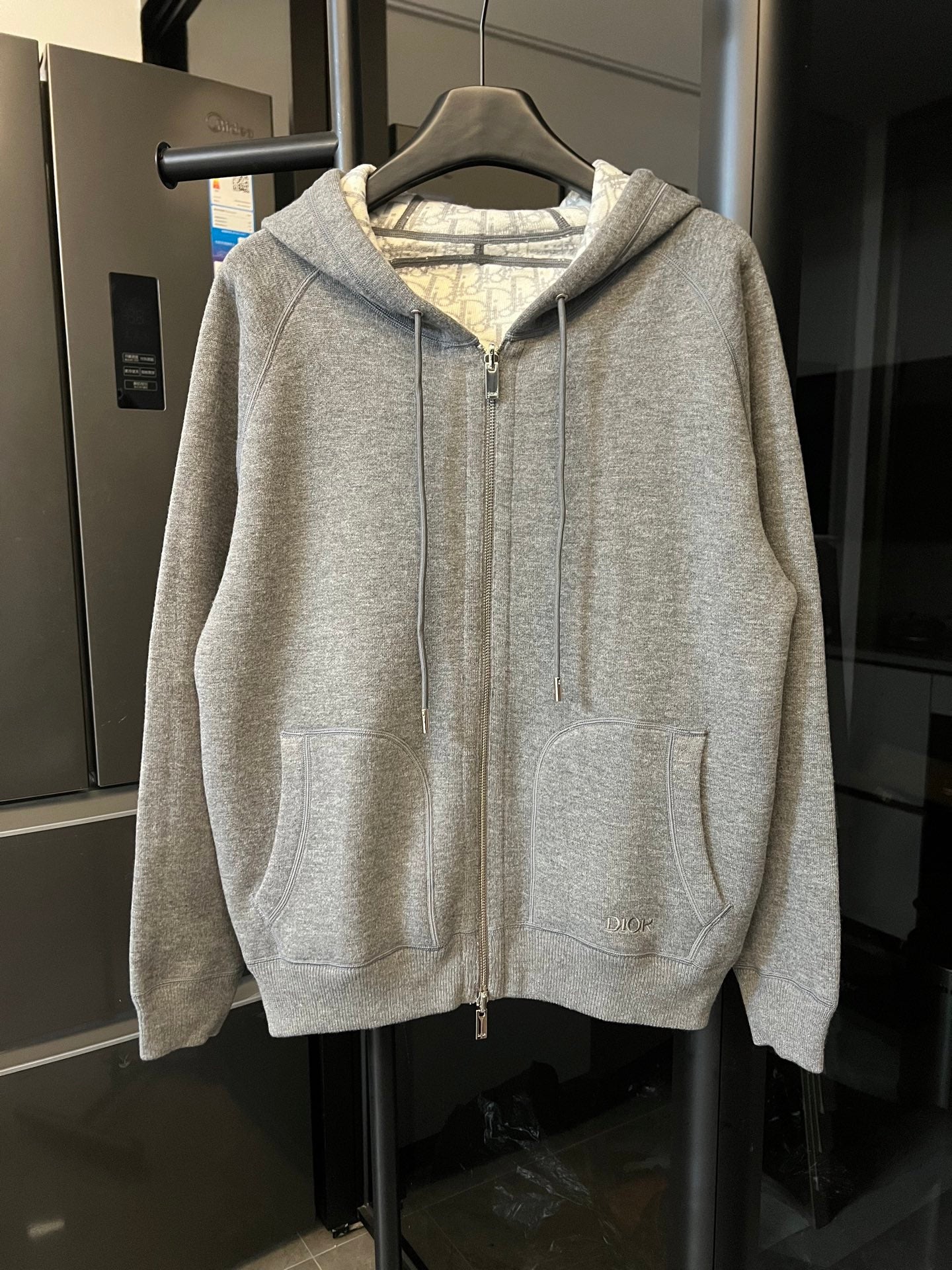 Gray heather zip-up hoodie with hood, front zipper, and kangaroo pocket