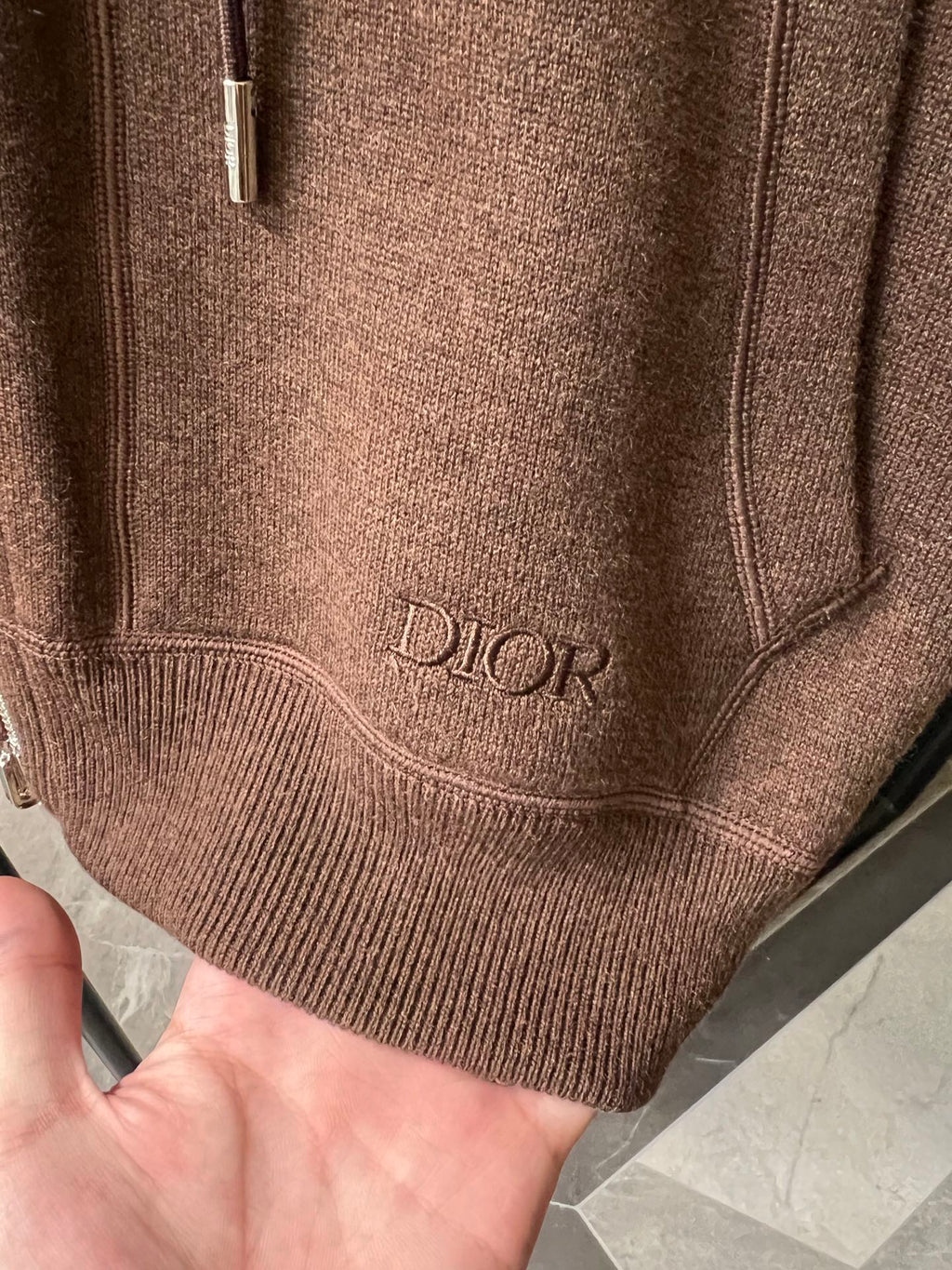 Dior brown knit hoodie hem with embroidered Dior logo