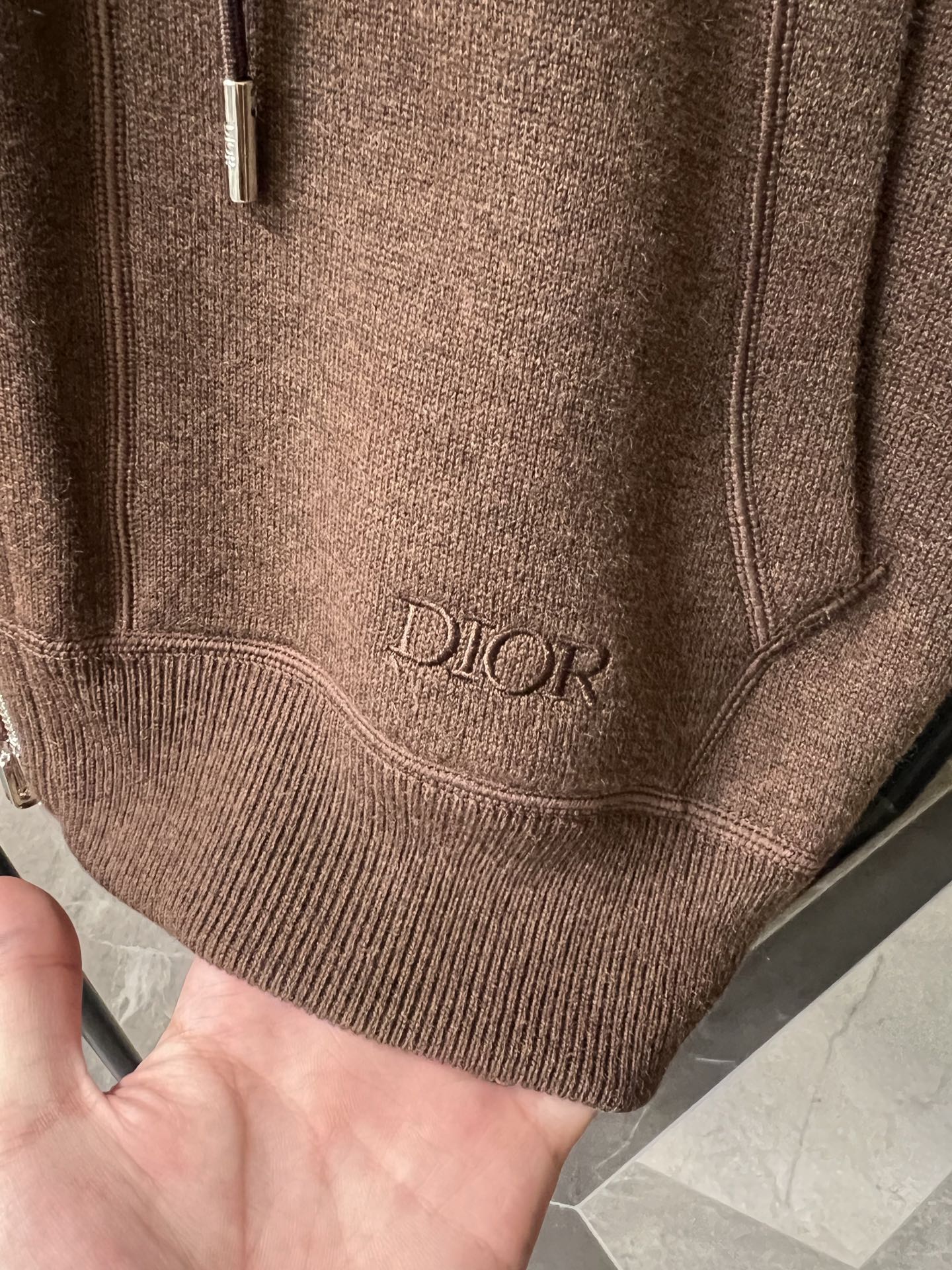 Dior brown knit hoodie hem with embroidered Dior logo