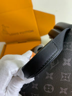 Louis Vuitton monogram backpack strap and top edge, dark gray leather trim