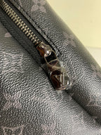 Louis Vuitton monogram backpack zipper pull, silver-tone hardware on leather