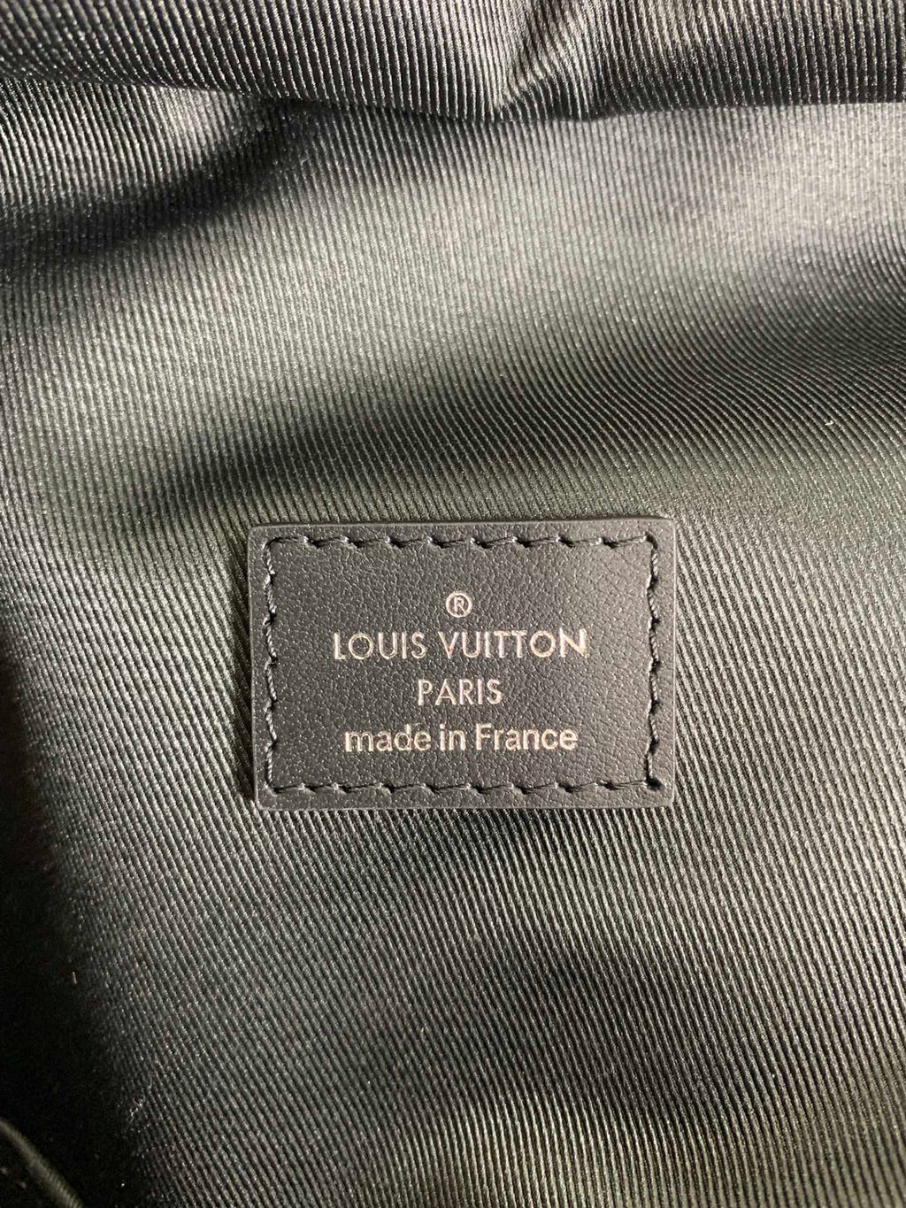 Louis Vuitton Paris made in France label on monogram backpack fabric