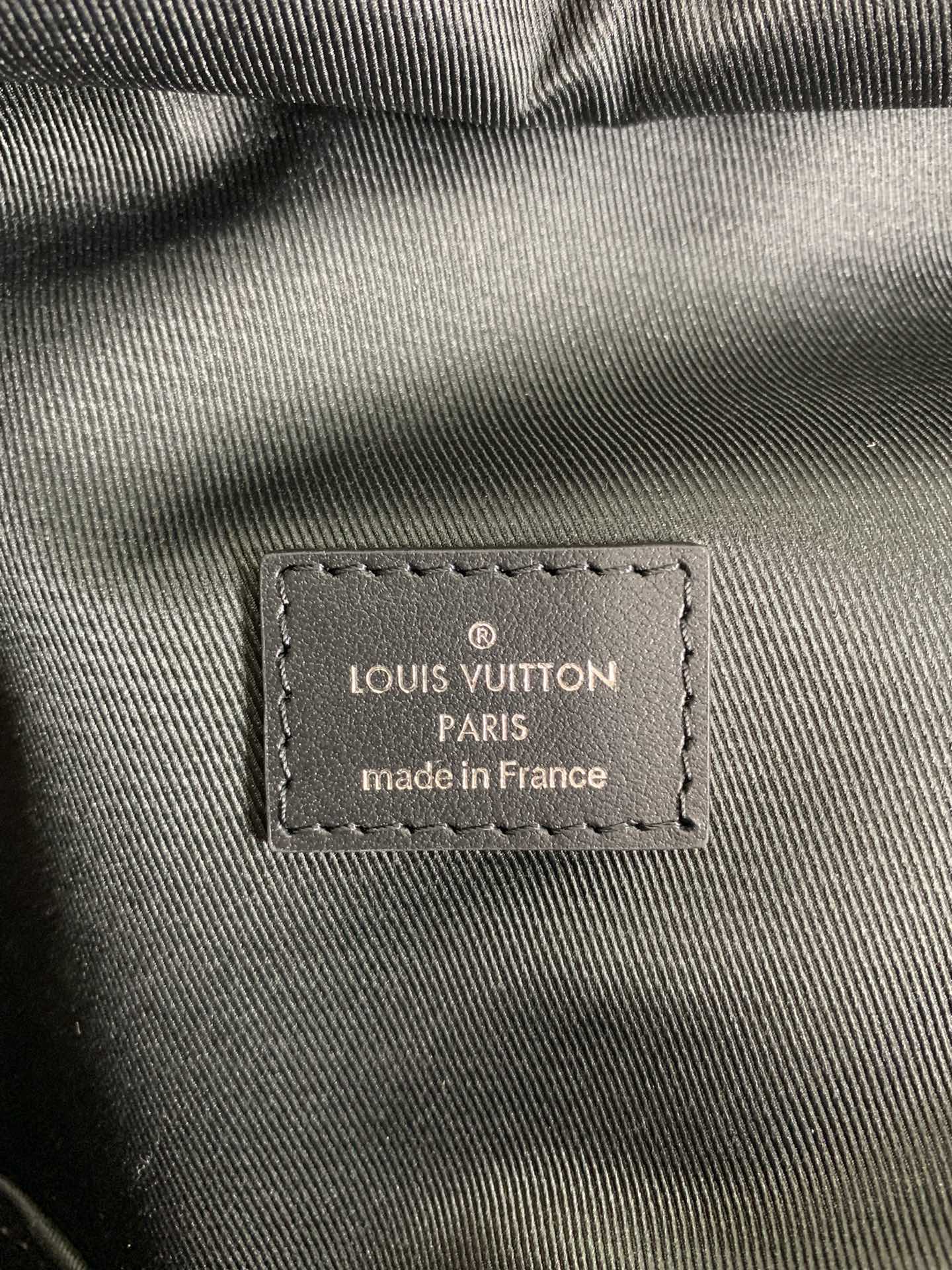 Louis Vuitton Paris made in France label on monogram backpack fabric