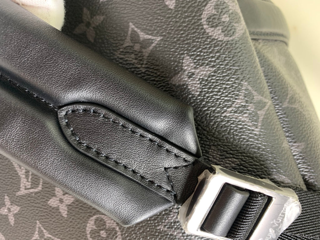 Louis Vuitton monogram bag front pocket with leather trim and snap closure, dark gray