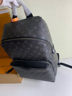 Louis Vuitton monogram backpack, dark gray with front zip and top zipper